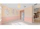 Charming bedroom with custom wall décor, built-in shelving, soft carpet, and natural lighting at 1011 Wood Cv, Kissimmee, FL 34743