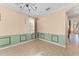 Bright entryway featuring tile flooring, a modern chandelier, and natural light streaming through multiple windows at 1011 Wood Cv, Kissimmee, FL 34743