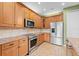 Open concept kitchen with stainless appliances and granite countertops at 1011 Wood Cv, Kissimmee, FL 34743