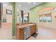 Inviting kitchen with granite countertops and views into adjacent living and dining areas at 1011 Wood Cv, Kissimmee, FL 34743