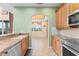 Lovely kitchen with stone backsplash, stainless appliances, and granite countertops at 1011 Wood Cv, Kissimmee, FL 34743
