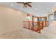 Spacious upstairs landing featuring carpeted floors, recessed lighting, and an open view at 1011 Wood Cv, Kissimmee, FL 34743