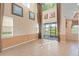 Bright living room boasts soaring ceilings, large windows, and access to the outdoor living space at 1011 Wood Cv, Kissimmee, FL 34743