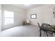 Bright bedroom with a neutral palette, large window, and comfortable seating area for relaxation at 14217 Sapphire Bay Cir, Orlando, FL 32828
