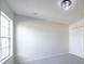 Bright, empty bedroom with a large window, neutral carpet, and a double door closet at 14217 Sapphire Bay Cir, Orlando, FL 32828