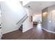 Inviting foyer features wood-look floors, staircase, and views into the living areas at 14217 Sapphire Bay Cir, Orlando, FL 32828