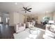Spacious, open-concept home with modern finishes seamlessly connecting living, kitchen and dining spaces at 14217 Sapphire Bay Cir, Orlando, FL 32828