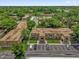 Aerial of complex with parking, trees and building exteriors at 200 St Andrews Blvd # 802, Winter Park, FL 32792