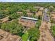 Expansive aerial view of a condominium community showcasing lush landscaping and ample parking at 200 St Andrews Blvd # 802, Winter Park, FL 32792