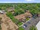Aerial of complex showing building exteriors, parking, and lush trees at 200 St Andrews Blvd # 802, Winter Park, FL 32792