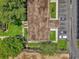 Overhead shot of roof and parking showing trees and grass at 200 St Andrews Blvd # 802, Winter Park, FL 32792