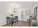 Charming dining area featuring modern decor, a chandelier, and seamless access to the kitchen at 200 St Andrews Blvd # 802, Winter Park, FL 32792
