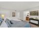Calm bedroom provides ample space, a well-lit ambiance, and a view into the bathroom at 200 St Andrews Blvd # 802, Winter Park, FL 32792
