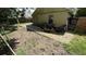 View of a spacious backyard with a fire pit and patio area that could be landscaped to create an outdoor oasis at 324 River Chase Dr, Orlando, FL 32807