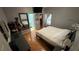 Cozy bedroom with a dresser, carpet flooring, a door to bathroom, and closet space at 324 River Chase Dr, Orlando, FL 32807