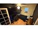 Bedroom features a ceiling fan, large TV, and a window AC unit at 324 River Chase Dr, Orlando, FL 32807