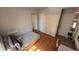 A bedroom featuring a twin bed, a closet and a tile floor at 324 River Chase Dr, Orlando, FL 32807