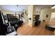 Open Dining Room featuring a long black table, and a wall decor at 324 River Chase Dr, Orlando, FL 32807
