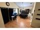Open Dining Room featuring a long black table, and a wall decor at 324 River Chase Dr, Orlando, FL 32807