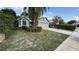 Single-Gathering home featuring a well-manicured lawn and a two-car garage at 324 River Chase Dr, Orlando, FL 32807