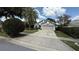 Charming single-Gathering home featuring a well-manicured lawn and a two-car garage at 324 River Chase Dr, Orlando, FL 32807