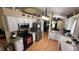 Bright kitchen with stainless steel appliances, white cabinetry and functional layout at 324 River Chase Dr, Orlando, FL 32807