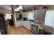 Well-lit kitchen features ample counter space, modern fixtures, and stainless steel appliances at 324 River Chase Dr, Orlando, FL 32807