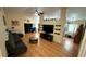 Open-concept living room with tile flooring, spacious seating, and open kitchen area at 324 River Chase Dr, Orlando, FL 32807
