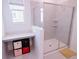 Contemporary bathroom with a glass-enclosed shower, built-in shelves, and a vanity area at 4152 Pino St, Apopka, FL 32712