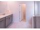 Bright bathroom featuring a sleek vanity, modern fixtures, and a glass-enclosed shower at 4152 Pino St, Apopka, FL 32712