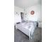 Bedroom with carpet, neutral walls, and a decorative clock above the bed at 4152 Pino St, Apopka, FL 32712