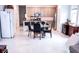 Kitchen and dining area featuring white tile floors and a center island at 4152 Pino St, Apopka, FL 32712