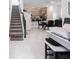 Open living area featuring tile floors, a staircase, dining table and chairs at 4152 Pino St, Apopka, FL 32712