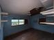 Empty bedroom with boarded up windows and spiral staircase at 728 Springview Dr, Orlando, FL 32803