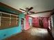 Living room with ceiling fan and turquoise-colored wall at 728 Springview Dr, Orlando, FL 32803