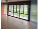 Empty living room with hardwood floor and a large picture window overlooking the front yard at 728 Springview Dr, Orlando, FL 32803