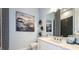Modern bathroom with sleek fixtures, minimalist decor, and a neutral color palette at 858 Arbor Green Trl, St Cloud, FL 34771