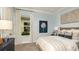 Well-lit bedroom featuring tasteful decor, large windows, and a comfortable bed at 858 Arbor Green Trl, St Cloud, FL 34771