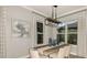 Cozy dining room featuring a modern table set, stylish lighting, and soft natural light at 858 Arbor Green Trl, St Cloud, FL 34771