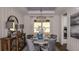 Elegant dining room with a stylish chandelier, a round dining table, and modern decor at 858 Arbor Green Trl, St Cloud, FL 34771