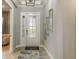 Elegant foyer with a modern front door, stylish lighting, and inviting entrance at 858 Arbor Green Trl, St Cloud, FL 34771
