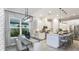 Open concept kitchen with a large island, pendant lighting, and adjacent dining area at 858 Arbor Green Trl, St Cloud, FL 34771
