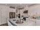 Modern kitchen with white cabinets, stainless steel appliances, and a large island with seating at 858 Arbor Green Trl, St Cloud, FL 34771