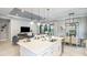 Open concept living room with modern finishes and seamless flow from kitchen to living spaces at 858 Arbor Green Trl, St Cloud, FL 34771