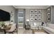 Cozy living room with comfortable seating, modern decor, and a large window with natural light at 858 Arbor Green Trl, St Cloud, FL 34771
