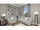 Comfortable living room with stylish decor, decorative lamps, and a window with a view of the yard at 858 Arbor Green Trl, St Cloud, FL 34771