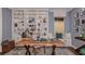 Well-appointed home office with custom built-ins, a comfortable seating area, and a large desk at 858 Arbor Green Trl, St Cloud, FL 34771