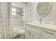 Cozy bathroom featuring tiled tub/shower, framed mirror, and vanity with a white countertop at 643 Oregon Woods Ct, Orlando, FL 32824
