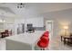 Stylish kitchen with white cabinets, stainless steel appliances, and bar seating at 643 Oregon Woods Ct, Orlando, FL 32824