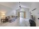 Bright living room with a vaulted ceiling, modern furnishings, and sliding glass doors at 643 Oregon Woods Ct, Orlando, FL 32824